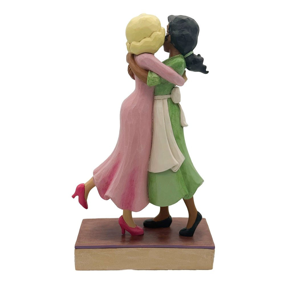 Gedetailleerd Disney Traditions beeld van Tiana en Charlotte Lottie La Bouff in kleurrijke folk-artstijl.