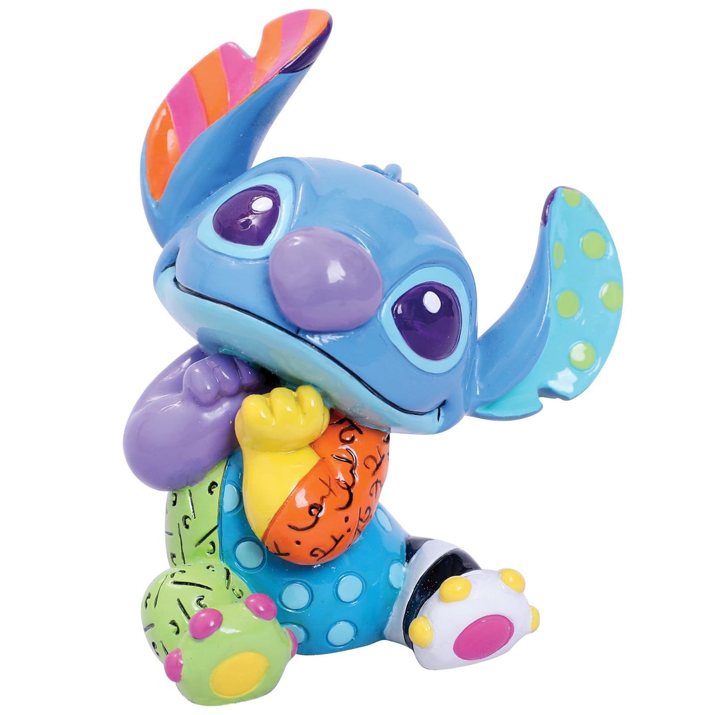 “Kleurrijk Britto Stitch beeldje van het blauwe buitenaardse wezen uit Hawaii, met hoogglans afwerking en handgeschilderde details, geleverd in een gelicentieerde geschenkdoos.”