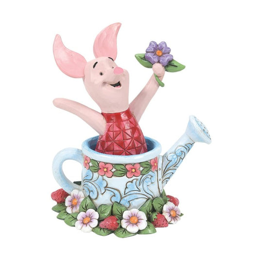 "Jim Shore miniatuur van Knorretje in een gieter, handgeschilderd met sierlijke patronen en levendige kleuren, speels en charmant."
